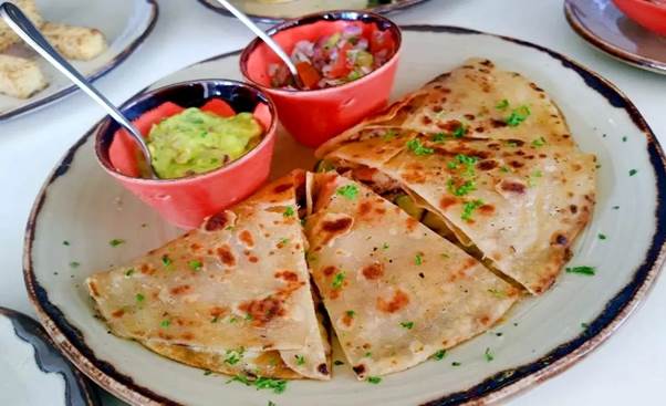 Kenyan breakfast mandazi with tea in Nairobi – Adequate Safaris