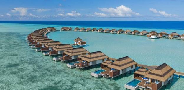 Soft white sandy beaches meeting clear ocean waters in Maldives islands – Adequate Safaris