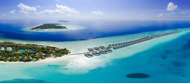 Luxury island resort surrounded by clear waters and coral reefs – Adequate Safaris